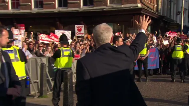 Jeremy Corbyn waves to the waiting crowd