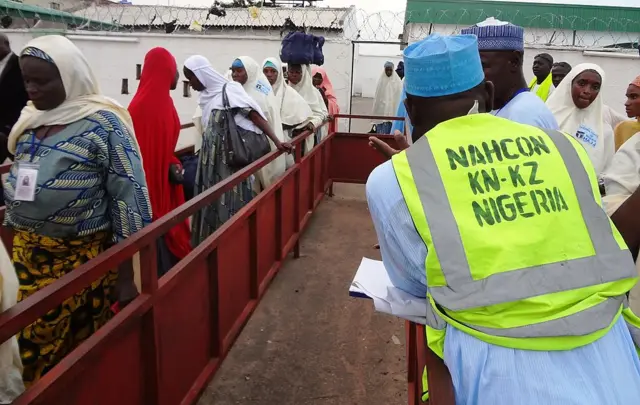 Nigerian hajj pilgrims leave the arrival hall of Mallam Aminu Kano International Airport