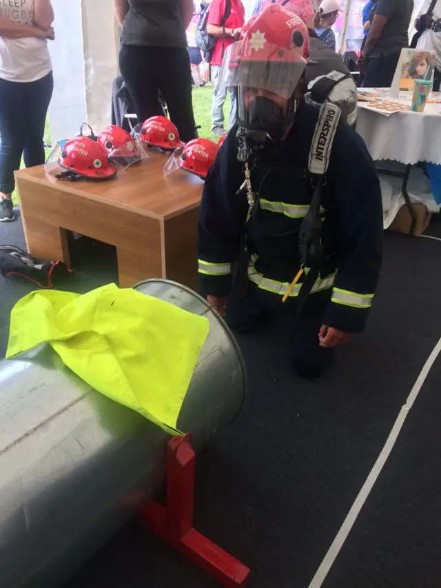 Marcus Lee in a junior firefighter's uniform