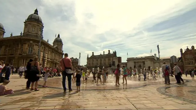 People playing in fountains in Hull's Queen Victoria Square