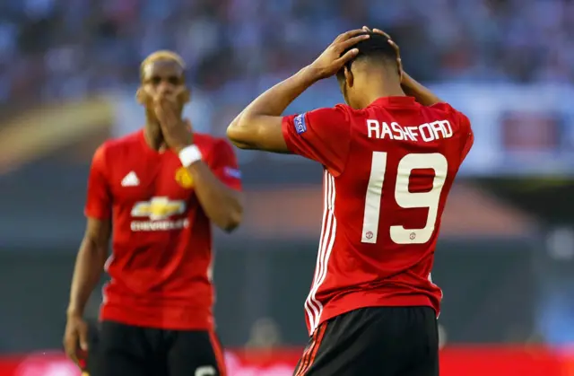 Marcus Rashford holds his head after a missed chance