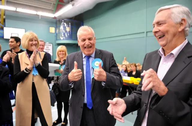 Conservative candidate Dick Madden celebrates