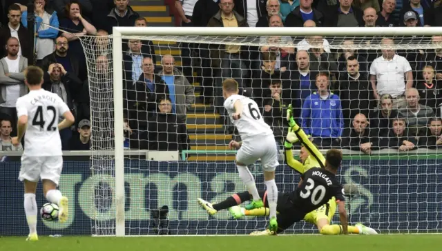 Alfie Mawson goes close