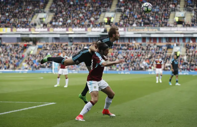 Burnley's George Boyd tries to keep West Brom's Craig Dawson away