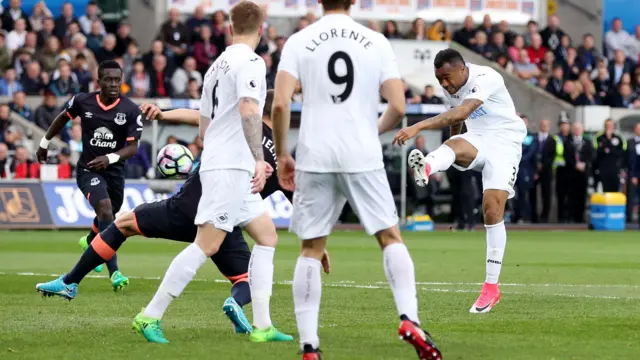 Jordan Ayew of Swansea City sees a shot hit the post