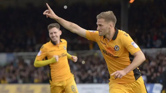 Mickey Demetriou celebrates