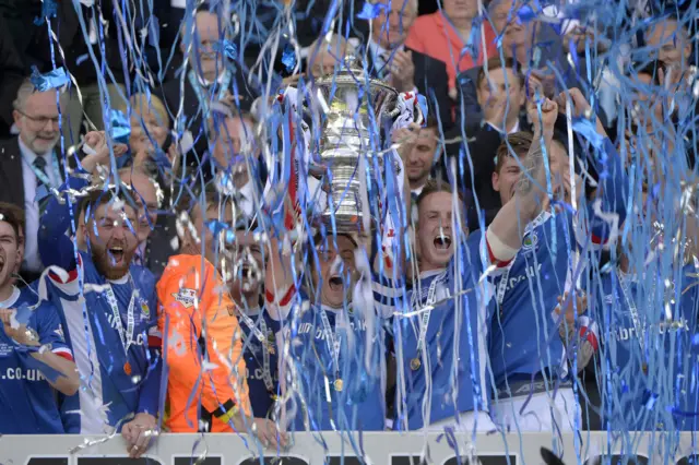 Linfield captain Jamie Mulgrew lifts the Irish Cup