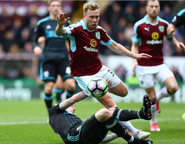 Burnley's Arfield is blocked by West Brom's James McClean