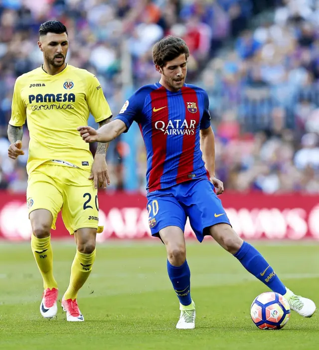 Barcelona's Roberto in action with Villareal's Soriano