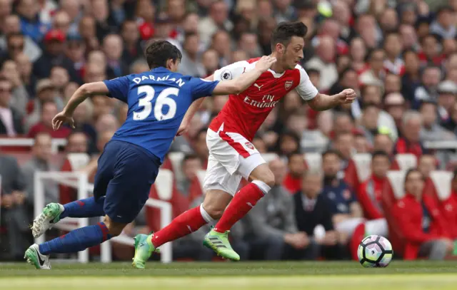 Ozil flies past Darmian