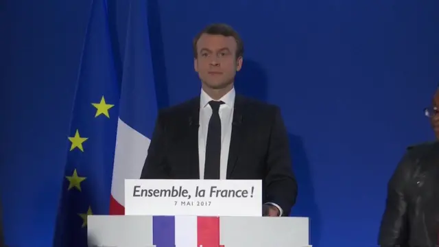 Macron standing stiff