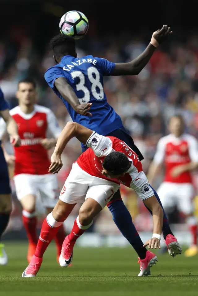 Tuanzebe heads the ball away from Sanchez