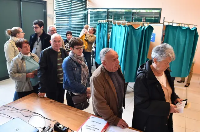 Queues at a polling station in Solesmes, north west France