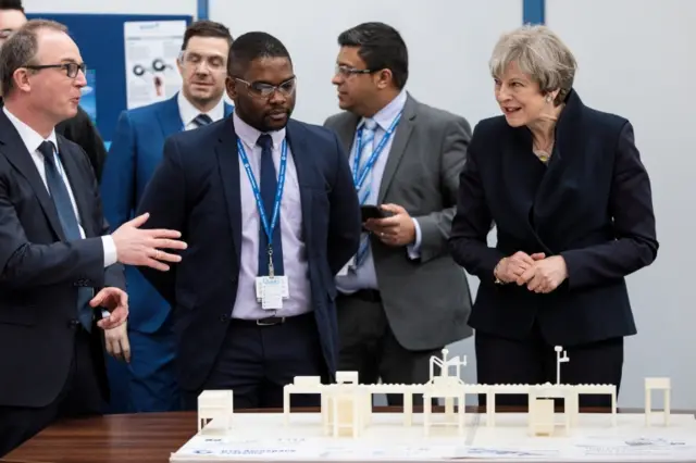 Theresa May tours the UTC Aerospace Systems factory in Wolverhampton with West Midlands Mayor Andy Street