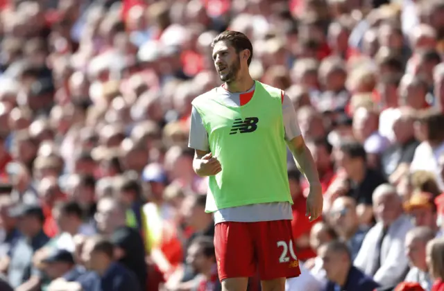 Adam Lallana warms up