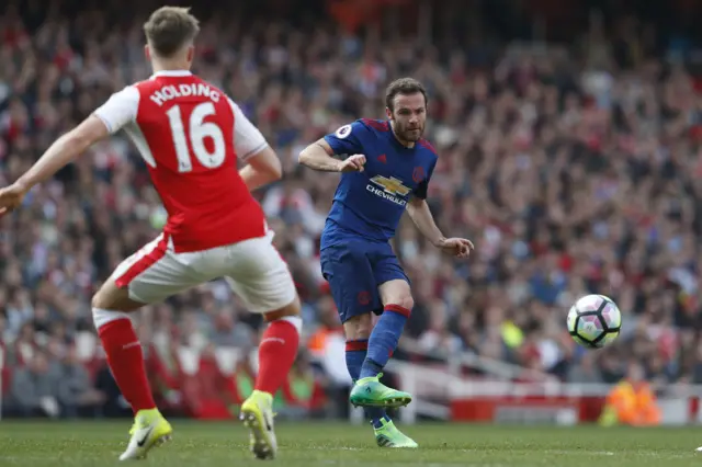 Mata takes the ball past Holding