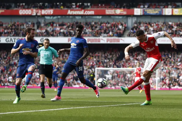 Kieran Gibbs fires past Axel Tuanzebe