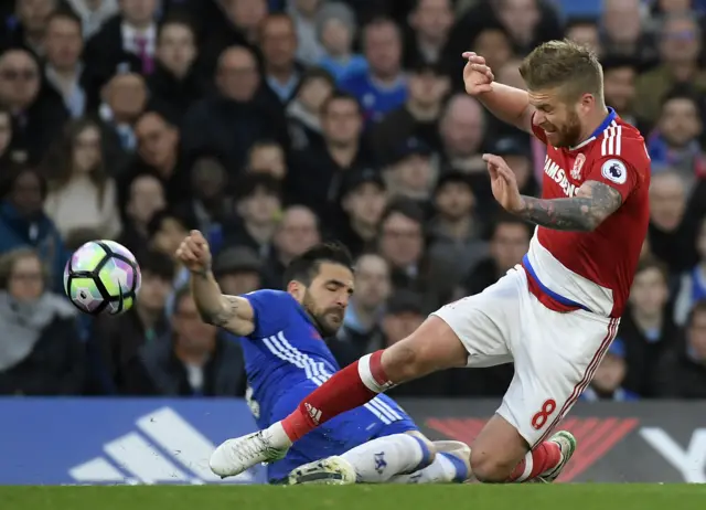 Adam Clayton tackles Cesc Fabregas