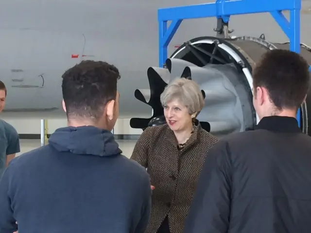 Theresa May with students at the aviation centre at Norwich airport