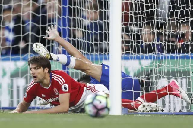 Diego Costa and George Friend compete for the ball