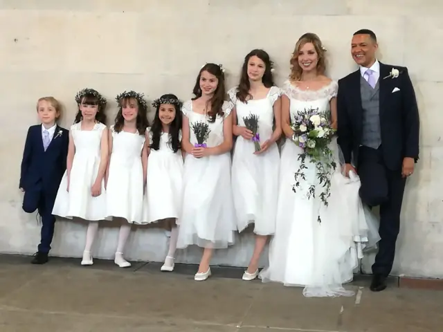 Clive Lewis with his bride, Katy Steel, and five bridesmaids and a page boy