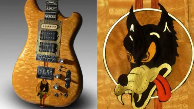 The wolf motif was added by the guitar's maker when it was sent back to him for repairs