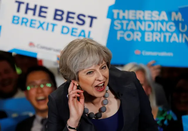 Theresa May reacts as she speaks at an election campaign event at Pride Park Stadium on 1 June in Derby, United Kingdom