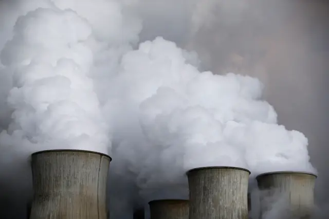 Steam rises from the cooling towers of the coal power plant of RWE, one of Europe's biggest electricity and gas companies in Niederaussem, Germany