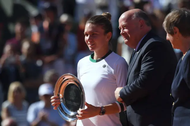 Simona Halep poses with the runners-up trophy