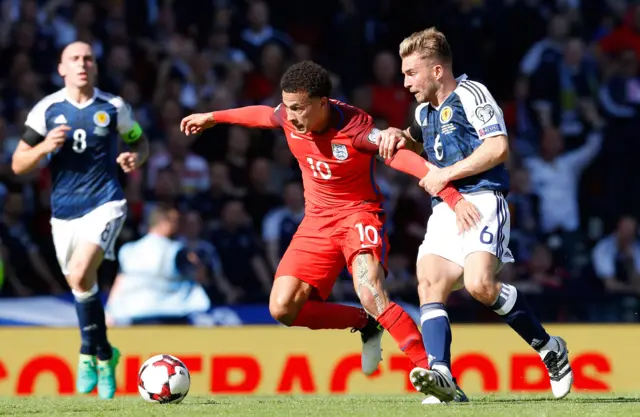 Dele Alli runs with possession