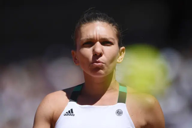 Simona Halep looks on