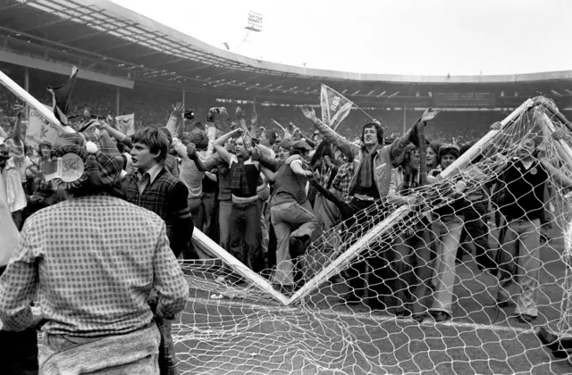 Fans on pitch