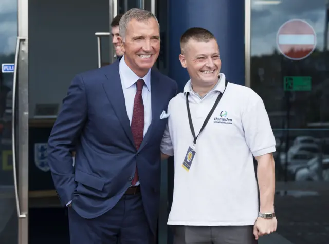 Former Scotland midfielder Graeme Souness poses for a photograph with a fan at Hampden