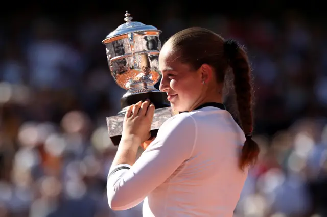 Jelena Ostapenko of Latvia lifts the Suzanne Lenglen Cup