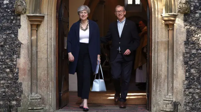 Theresa May and husband Philip attend a Holy Communion in Sonning