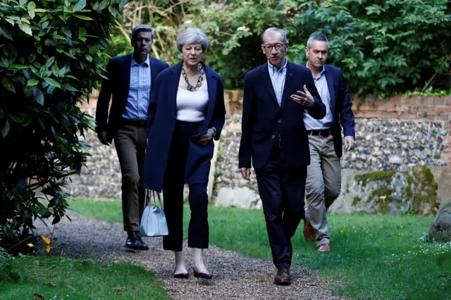 Theresa May and husband Philip attend a Holy Communion in Sonning