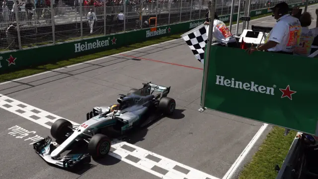 Lewis Hamilton crosses the finish line