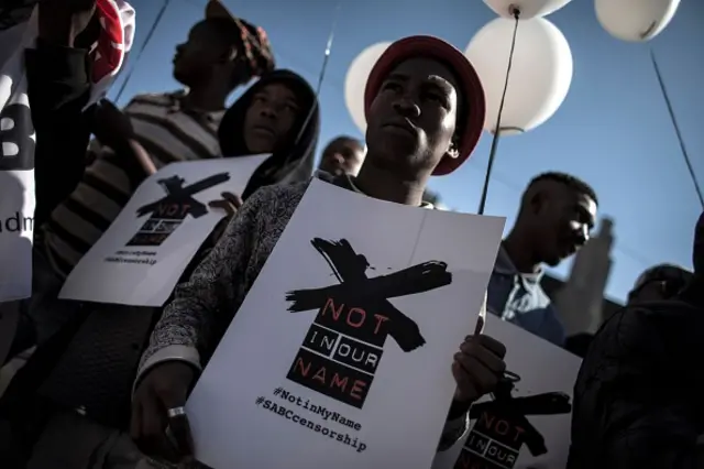 Demonstrators rally outside the offices of South Africa's public broadcaster on July 1, 2016 in Johannesburg to protest against alleged bias and self-censorship in news coverage ahead of key municipal elections.