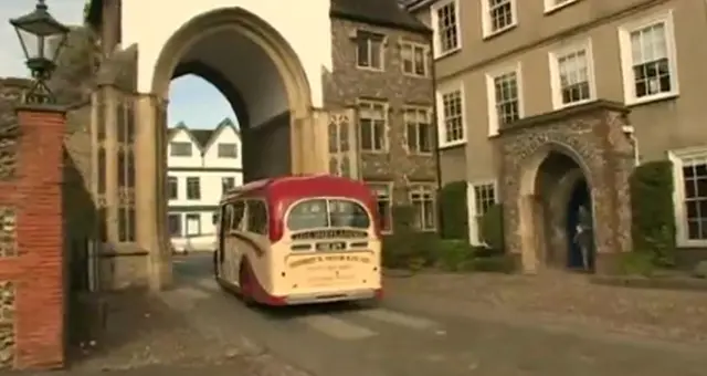 The coach departing through Cathedral arch