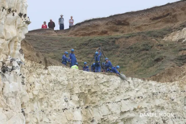 The RNLI's cliff rescue team helped winch him back up the cliff to safety