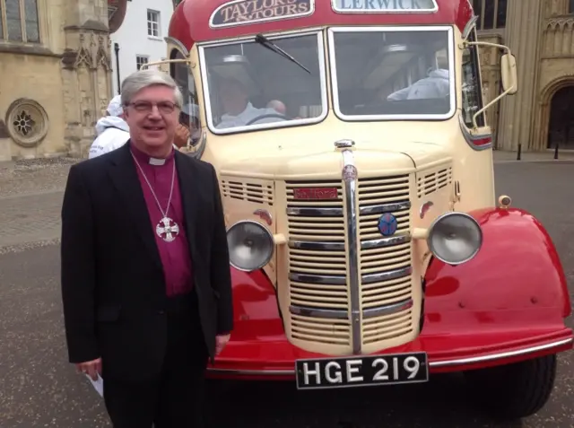 The Bishop of Norwich standing by the coach