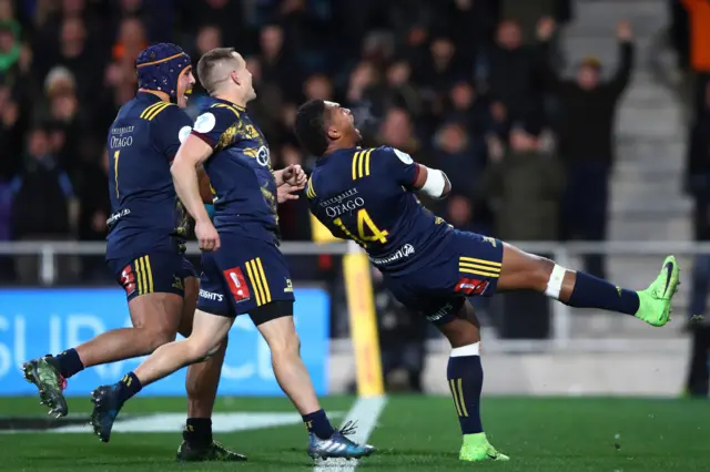 Waisake Naholo of the Highlanders celebrates scoring a try