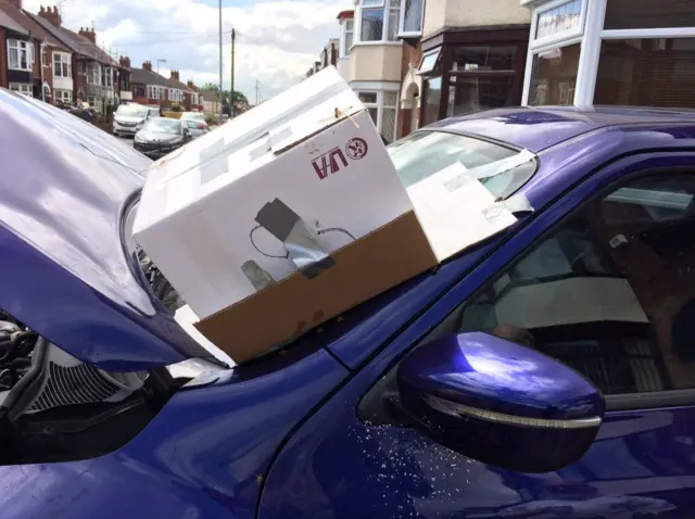 Bees are being removed from a car in Hull