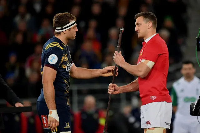 Highlanders' captain Luke Whitelock  presents British and Irish Lions' captain Sam Warburton with the sword