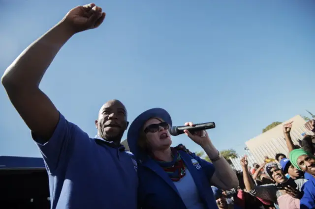 South African opposition party Democratic Alliance (DA) president Helen Zille and DA Gauteng Premier candidate Musi Maimane(L) address a crowd of supporters during an elections campaign rally in Johannesburg Alexandra township on April 30, 2014.