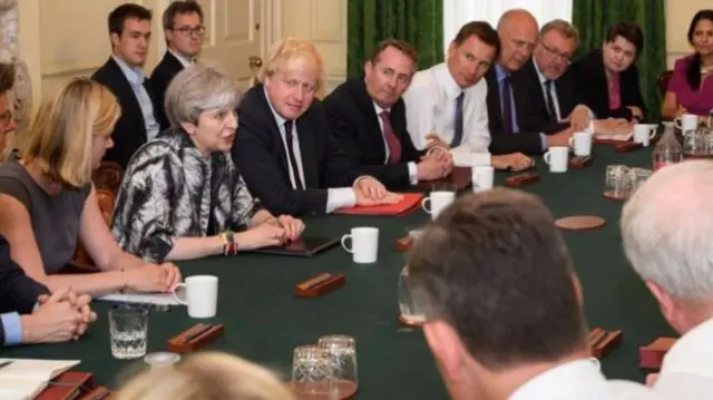 Chris Grayling (fourth from the right) has taken up his position in Theresa May's new cabinet