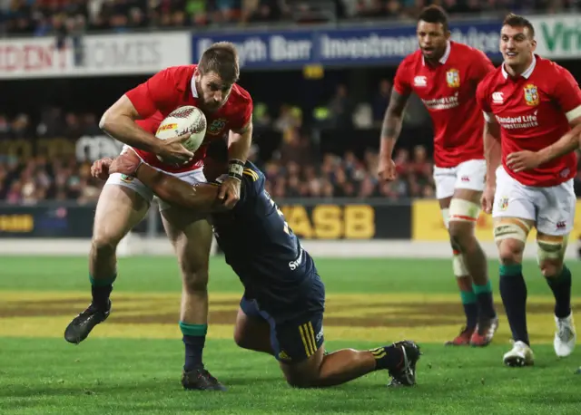 Tommy Seymour of the Lions is tackled short of the tryline