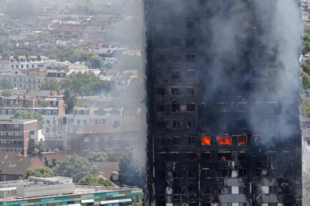 Flames and smoke engulf Grenfell Tower,