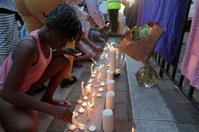 Candles are lit outside Notting Hill Methodist Church