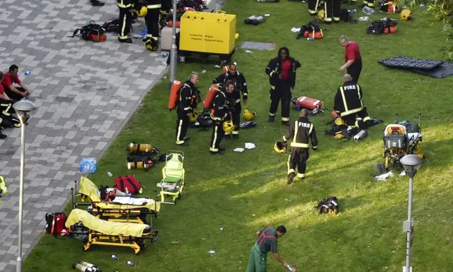 Firefighters on a patch of grass